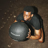 Man performing an exercise with a Northern Wall Ball during gym training