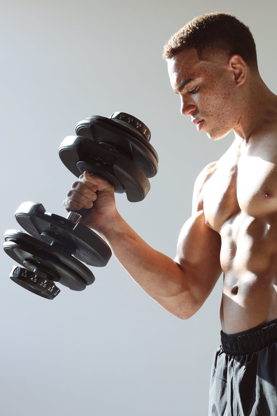 Performs a Bicep Curl Workout with an Adjustable Dumbbell from Northern