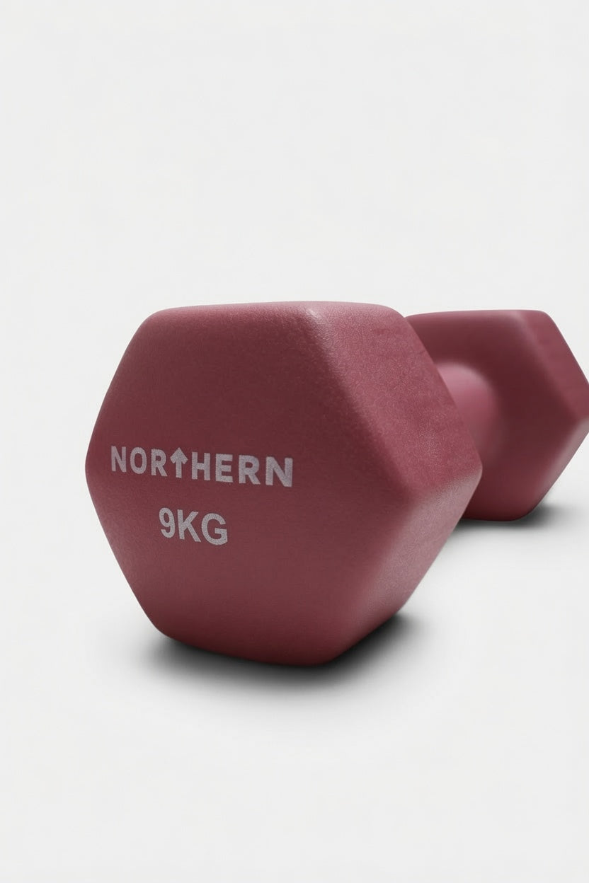 Close-up View of Northern Dusk Pink 9KG Neoprene Coated Hex Dumbbells
